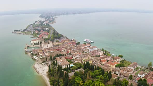 Aerial View of Historic Island of Sirmione in Lake Garda Italy Ancient Village in South of Lake alt