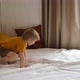 Funny Cheerful and Cute Little Blond Boy Awakening Jumping on a Bed - VideoHive Item for Sale