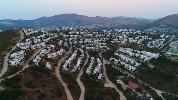 Flying to the over residential buildings on the shore of Bodrum. Turkey.