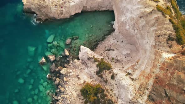 Aerial drone view of the Ionian Sea coast of Zakynthos, Greece. Rocky cliff, vegetation alt