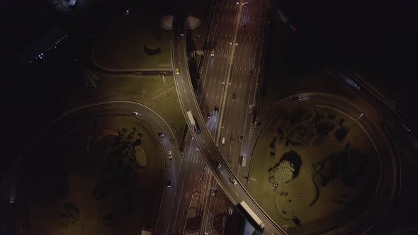 road junction with traffic flow at night