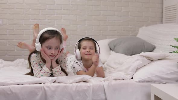 Little Child Baby Girl Listening To the Music with Headphones