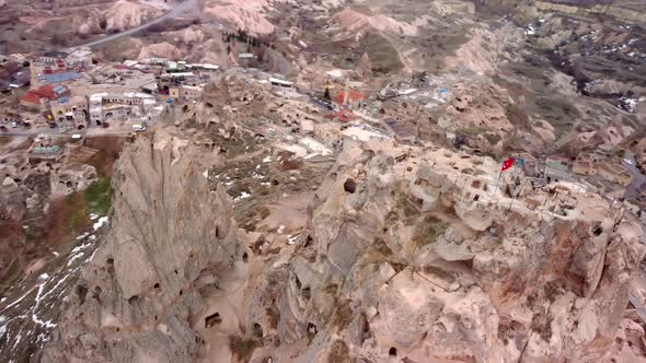 Sunset in cappadocia red valley of fairy chimneys , Aerial drone flight over beautiful and ancient c alt