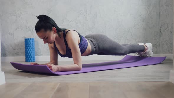 A Woman Goes in for Sports at Home alt