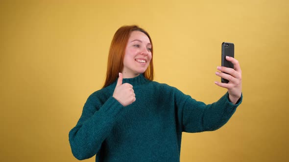 Cheerful Young Woman Talking on Mobile Phone Making Video Call