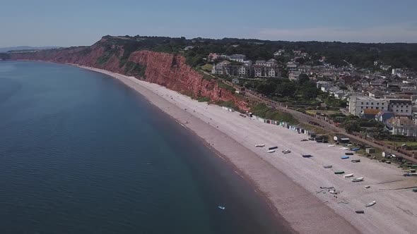 Aerial view of Budleigh Salterton beach with its red colored cliffs and its pebble beach. There are alt