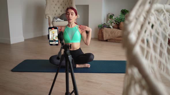Fit Sports Woman Filming Her Fitness Video Blog on Mobile Phone alt