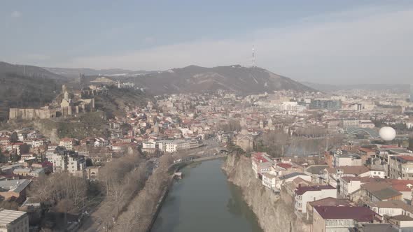 Aerial view of Metekhi church in old Tbilisi located on cliff near river Kura. Georgia 2021 winter alt