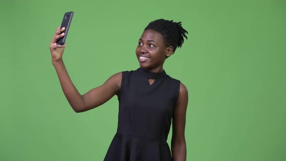 Young Beautiful African Businesswoman Taking Selfie