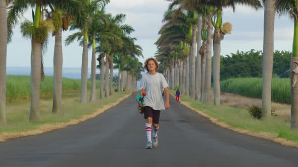 Young Cool Man Teenager Hipster in California Rides His Skateboard on Boardwalk Beach alt