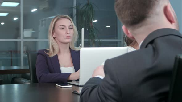 Young blond businesswoman working communicate with colleagues