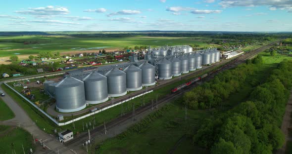 View of a Grain Elevator and a Traveling Train