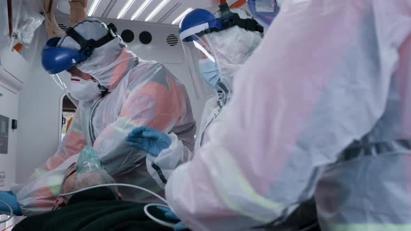 Paramedics Measuring Blood Pressure of Patient alt