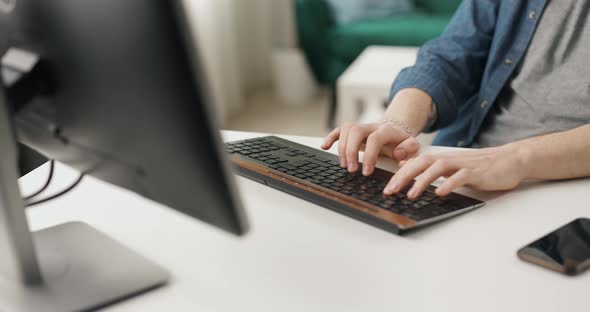 Male Hands Typing on Keyboard