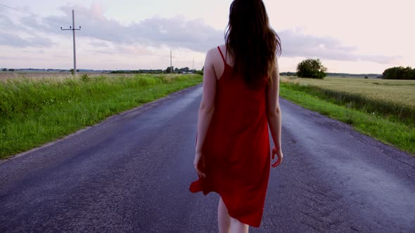 Follow the Girl in the Red Dress Along the Road