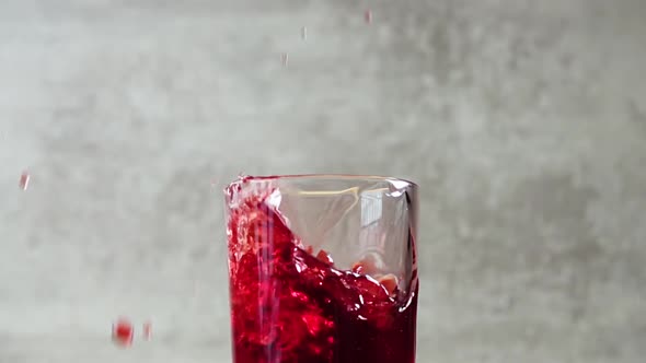 Ice Cube Fall in Cherry Juice