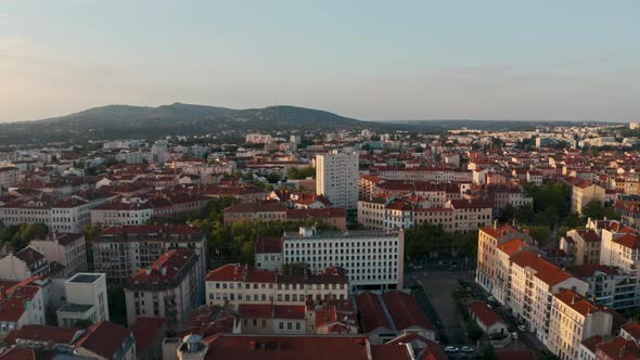Slider drone shot of dense residential buildings in Lyon France alt