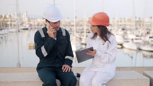 Port Workers Filling Documents for Yacht Registration alt