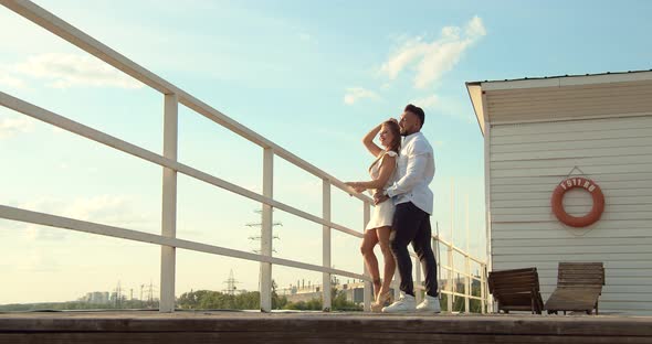 Couple Standing in Port in Summer