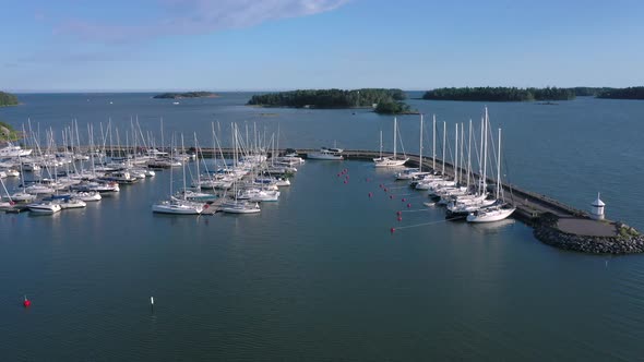 White Boats and Yachts Docking on the Port of Lauttasaari in Helsinki Finland alt