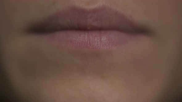 Macro close-up woman brown eye. Blinking eye, mowing eyeball, watching around. Eyelash, eyelid. alt