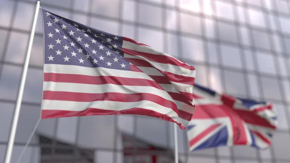 Waving Flags of the USA and the UK at Modern Skyscraper alt