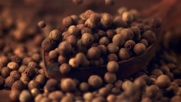Super Slow Motion on a Wooden Spoon Fall Peas of Black Pepper alt