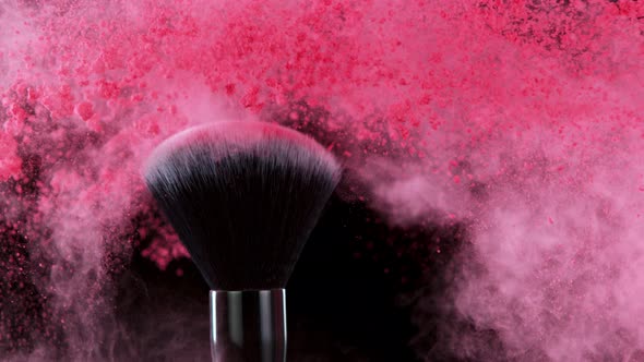 Super Slow Motion Shot of Makeup Brush and Pink Powder Shake at 1000 Fps alt