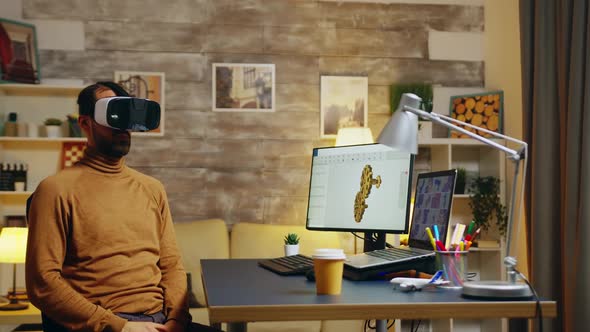 Male Engineer Working in His Home Office on a New Technology alt