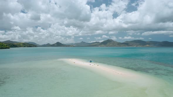 Aerial Drone  Tourist Banca Boat Moored at Sandbar During Low Tide alt