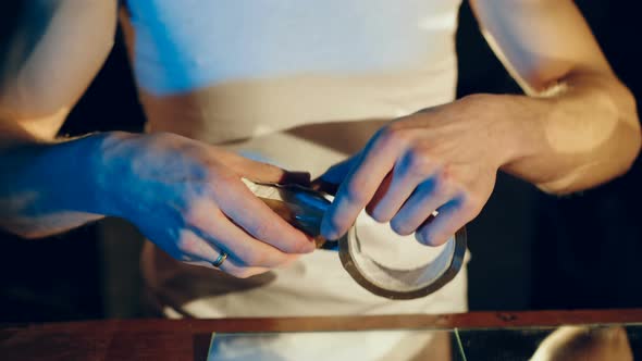 Drug Dealer Packs a Package with Heroin alt