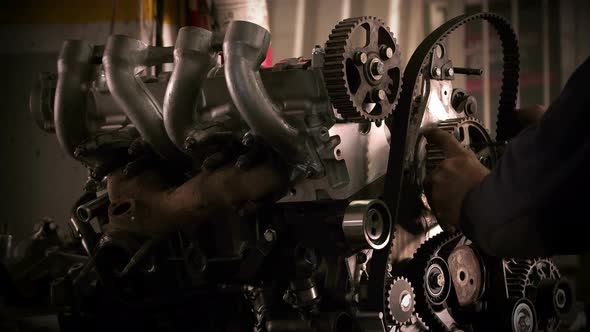 Car Mechanic Wears Timing Belt 2 alt