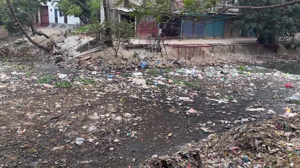 City canal filled with trash. Environment pollution. Asia, Dhaka, Bangladesh. alt