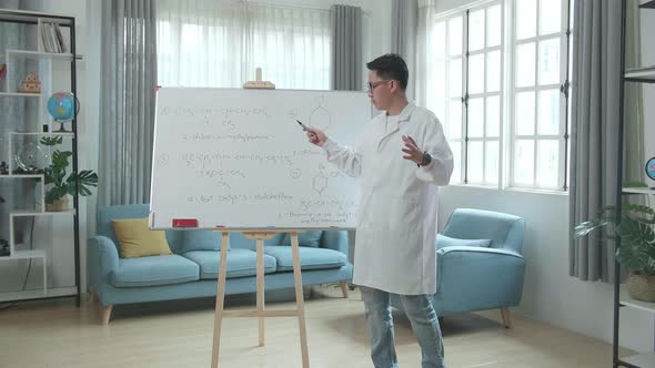 Asian Male Teacher With Glasses Teaching Chemist At Home alt