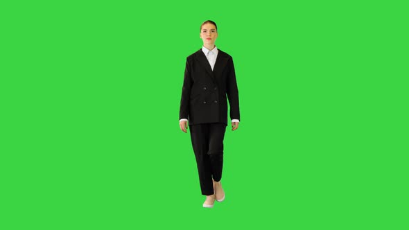 Young Woman in Office Suit Walking Adjusting Her Jacket on a Green Screen Chroma Key alt