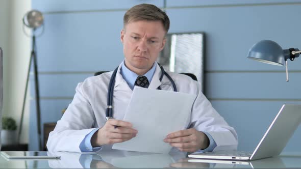 Doctor Reading Documents alt