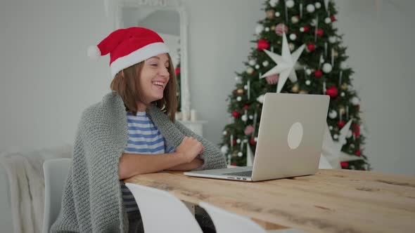 Woman use laptop at Christmas alt