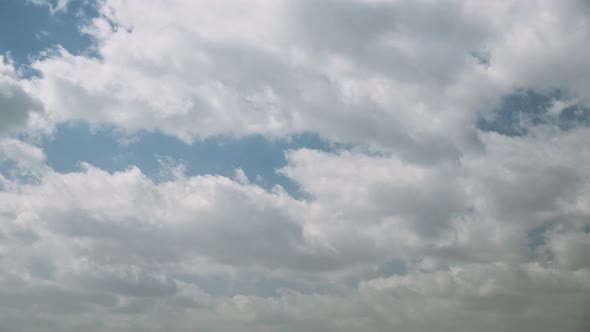 Sun Rays Shining Through Cloudy Sky With Fluffy Clouds During Dust Storm alt