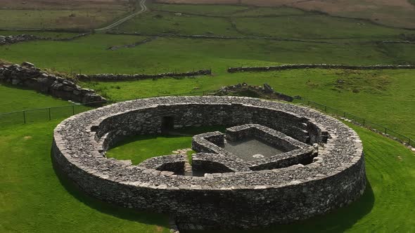 Loher Ringfort, Kerry, Ireland, March 2022. Drone orbits the ancient monument at a low altitude from alt