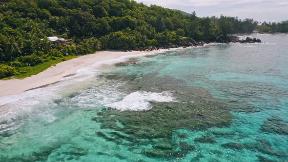 Aerial Top View of White Sand Paradise Tropical Beach Anse Bazarca at Mahe Island Seychelles alt