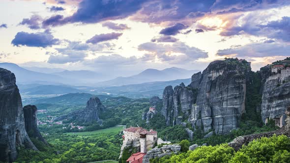 Beautiful timelapse view of clouds fly over Meteora valley, rocks and monasteries in Greece at day