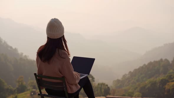 Young woman freelancer traveler working online using laptop