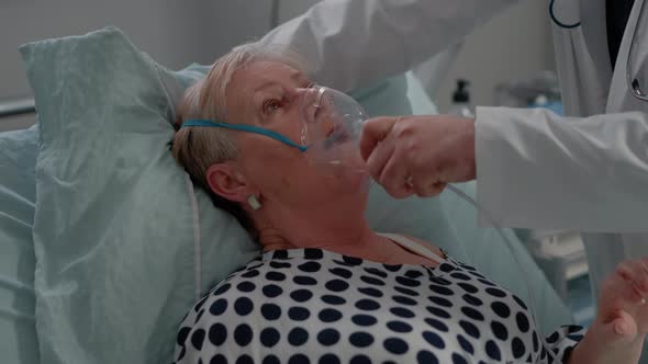 Sick Patient Breathing Heavily While Doctor Giving Help alt