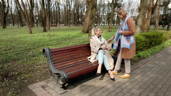 Two Women Sitting on Bench