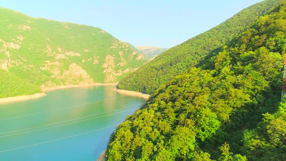 Aerial Video of Mountain Piva Lake and Mountains at Sunset alt