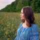 Smiling Ukrainian Woman Standing in Yellow Canola Field - VideoHive Item for Sale