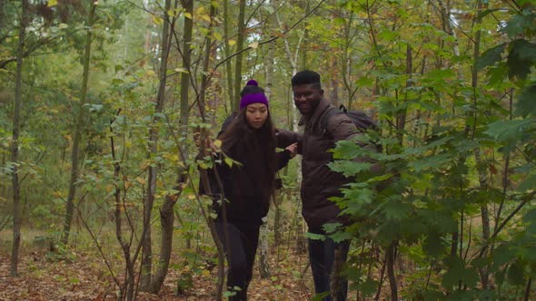 Excited Travelers Couple Giving High Five on Hike alt