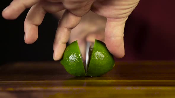 Hands Cut Lime with a Knife
