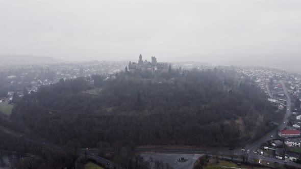 Aerial footage of Braunfels castle on a gloomy winter day. Aerial approaching shot alt