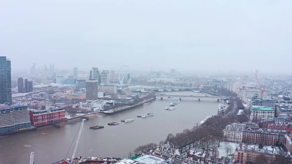 London snow aerial drone slider shot south bank waterloo bridge london eye alt